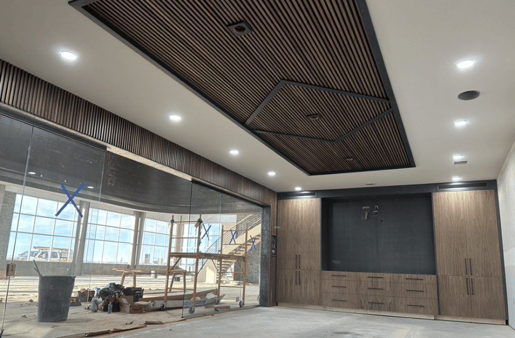 The custom ceiling and wall - built using solid walnut slats